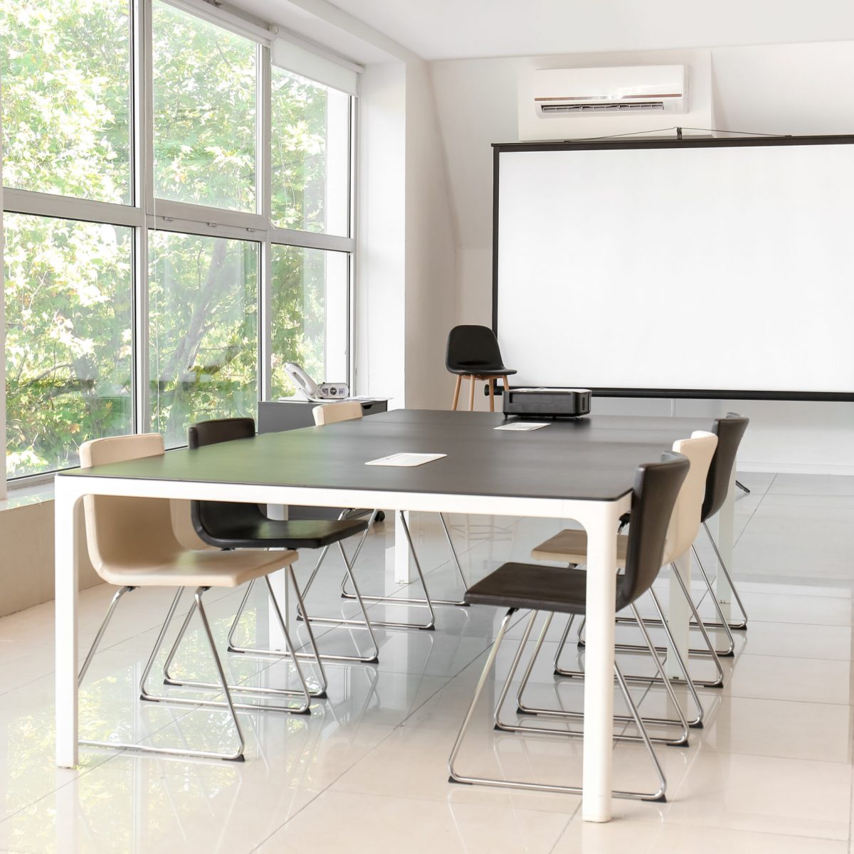 Room with projector prepared for conference in office
